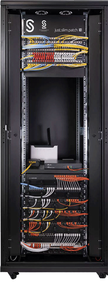 Close-up of network patch panels with multi-colored Ethernet cables neatly connected, on a black background.